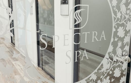 The door into the Spectra Spa with the logo and a cute pattern on it